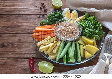 Salad With Vegetables, Eggs And Tofu Gado-gado On A Wooden Background