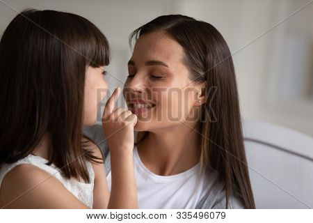 Child Enjoy Time With Mom Touch Her Face Showing Love