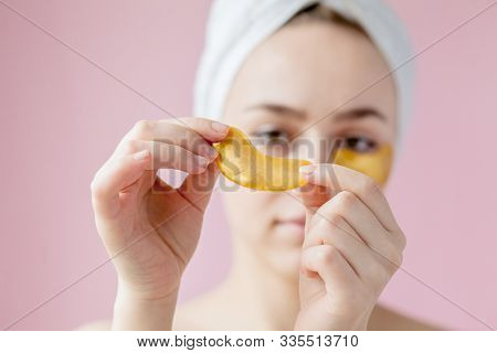 Portrait Of Beauty Woman With Eye Patches On Pink Background. Woman Beauty Face With Mask Under Eyes