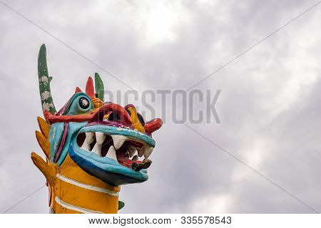 Low Angle Zoomed In View Of The Statue Of A Dragon. Mythology And Chinese Harvest Concept