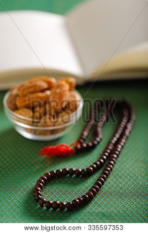 Date Fruits With An Islamic Prayer Beads On An Artistic Background. Beautiful Background For Ramzan 