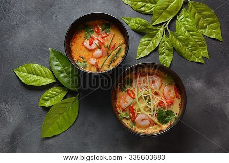 Laksa Soup - A Malaysian Coconut Curry Soup With Shrimps Over Rice Noodles Topped With Fresh Bean Sp
