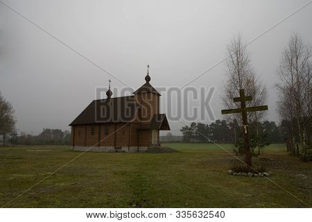 Beautiful Old Historic Historical Wooden Church On A Gray Autumn November Day, Poland