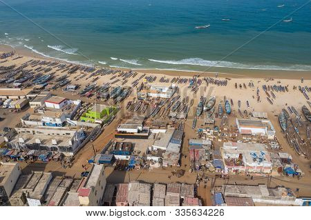 Aerial View Of Fishing Village, Pirogues Fishing Boats In Kayar, Senegal.  Photo Made By Drone From