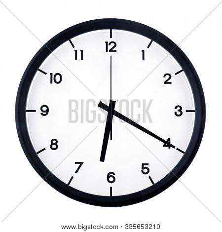 Classic analog clock pointing at six twenty, isolated on white background.