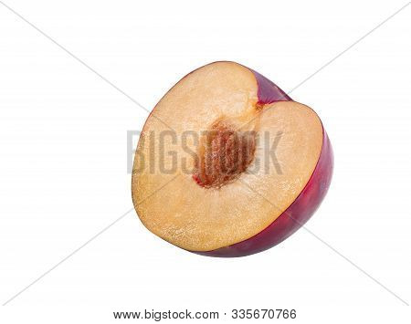 Half Of A Smooth-skinned, Mellow, Purple Plum Fruit With Kernel Isolated On White Background With Co