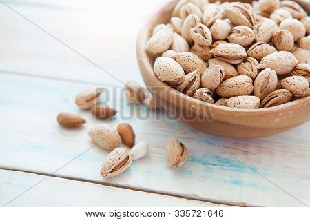 Unpeeled Almonds Badam In A Wooden Cedar Plate