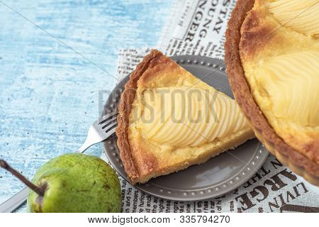 Delicious Home Bake Poached Pear Tart Pie, As Known As Tarte Bourdaloue, A Cup Of Coffee Latte. It I