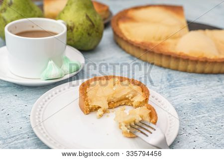Delicious Home Bake Poached Pear Tart Pie, As Known As Tarte Bourdaloue, A Cup Of Coffee Latte. It I