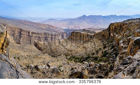 Panoramic view of Wadi Ghul aka Grand Canyon of Arabia in Jebel Shams, Oman