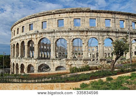 Ancient Roman Amphitheater In Sunny Day In Pula, Istria, Croatia, Europe. Roman Colosseum. An Arena
