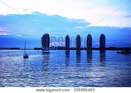 Boat On The Background Of Phoenix Island, China, Sanya, Hainan Island In The Evening