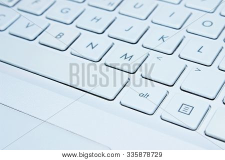 Blurred Image Of White Laptop Kayboard,  Close Up.  Laptop, Technology Concept.