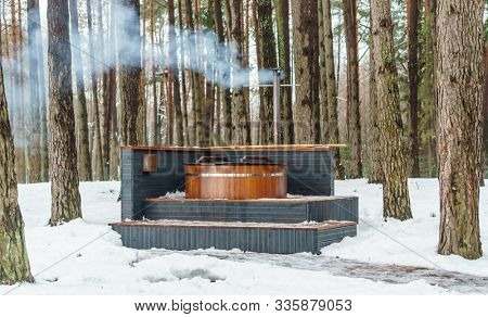 outdoor bathhouse, winter spa in the forest