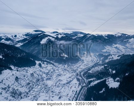 Calm And Cosy Fairy-tale Village Kryvorivnia Covered With Snow In The Carpathians Mountains, Aerial 
