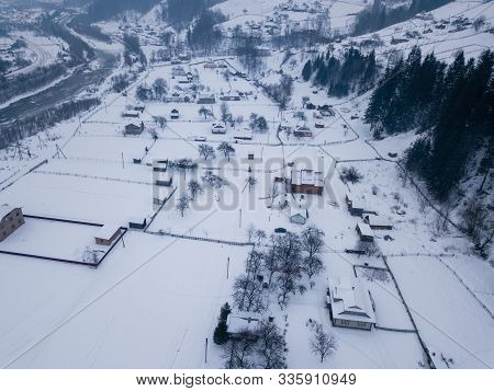Calm And Cosy Fairy-tale Village Kryvorivnia Covered With Snow In The Carpathians Mountains, Aerial 