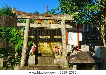 Kyoto, Japan - October 10, 2019: View Of A Torii Gate, And A Fox (kitsune) Figure, On The Inari Moun