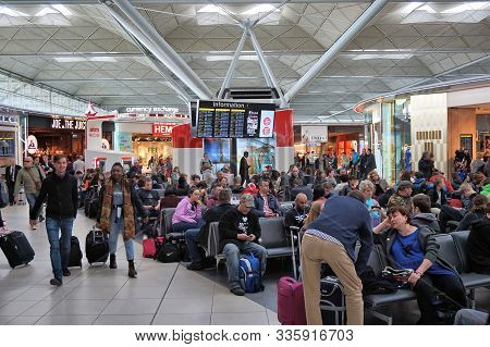 London, Uk - April 24, 2016: People Visit Duty Free Shops In London Stansted Airport, Uk. With 22.5 