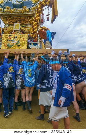 Himeji, Japan - October 14, 2019: Portable Shrine Lifted By Men In Traditional Dressing, And Crowd. 
