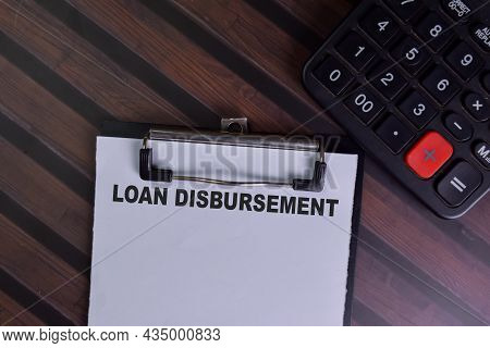 Loan Disbursement Write On A Paperwork Isolated On Wooden Table.