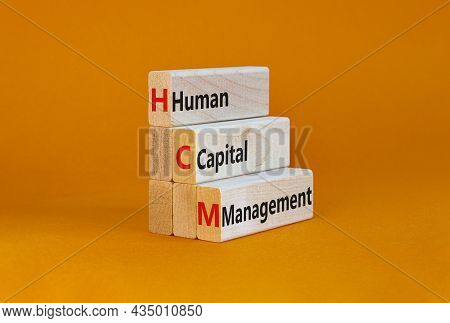 Hcm, Human Capital Management Symbol. Concept Words Hcm, Human Capital Management On Wooden Blocks O