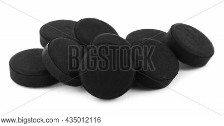 Activated Charcoal Pills On White Background. Potent Sorbent