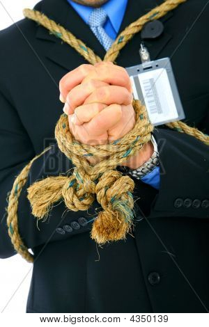 Closeup Hand der Geschäftsmann mit Seil gebunden