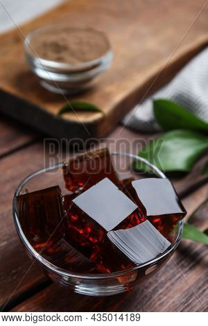 Delicious Grass Jelly Cubes On Wooden Table, Closeup