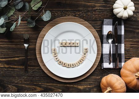Place Setting With Plate, Charger And Napkin On A  Decorated Table Shot From Flat Lay Or Top View Po