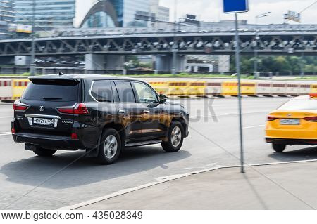 Lexus Lx450d Fast Moving On Highway Road. Overspeed In City Concept. Suv Car On City Road In Motion,