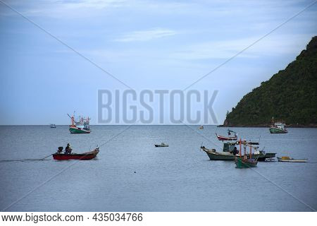 View Landscape Seascape And Fishing Boat Floating In Sea Waiting Catch Fish And Marine Life In Ocean