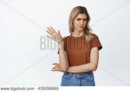 Emotions And Gestures. Picky And Skeptical Blond Woman Say No, Wave Hand In Refusal Gest, Rejecting 