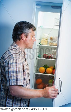 The Mature Men At Fridge  With Food