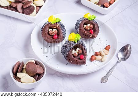 Chocolate Cake In The Form Of Hedgehogs On A White Plate
