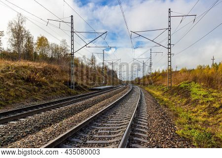 Rural Autumn Landscape On Empty Railroad In Siberia. Railroad Tracks Receding Into The Distance. Ind