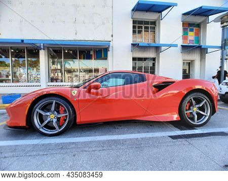 Los Angeles, California Usa - March 24, 2021: Red Ferrari F8 Tributo Luxury Sport Car Low Side View.