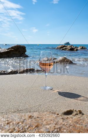 Summer Time In Provence, Glass Of Cold Rose Wine On Sandy Beach And Blue Sea Near Saint-tropez, Var