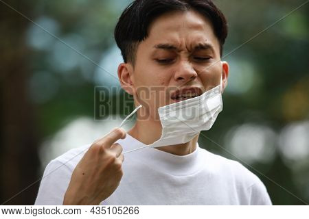 Image Of A Man With A Broken Mask