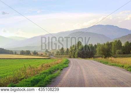 Uymon Valley In The Altai Mountains Under The Blue Evening Sky. Siberia, Russia