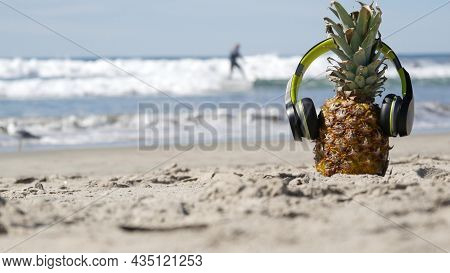 Funny Pineapple In Headphones, Sandy Ocean Beach, Blue Sea Water Waves, California Pacific Coast, Us