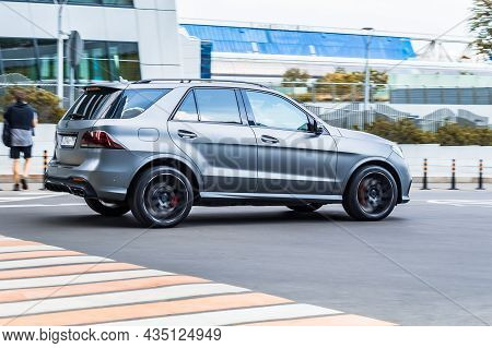 Fast Moving Gray Mercedes-benz Gle 400 4matic Suv Rides On A City Road. A Car On Street In Motion. O