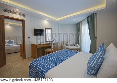 Double Bed In Family Room Suite Of A Luxury Hotel With Adjoining Bedroom