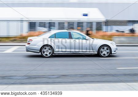 Mercedes S Class W221 At The City Road In Motion. Silver Car Driving Along The Street On High Speed 