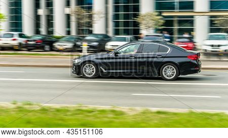 Black Car Bmw 5 Series G30 Is Driving On Asphalt Road On High Speed In The City Moscow. Moscow, Russ