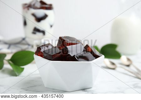 Delicious Grass Jelly Cubes On White Marble Table, Closeup