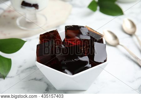 Delicious Grass Jelly Cubes On White Marble Table, Closeup
