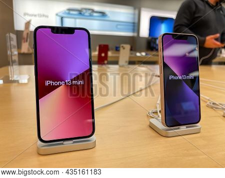 Cologne, Germany - October 01st 2021: A German Photographer Comparing And Testing The New Iphone 13 