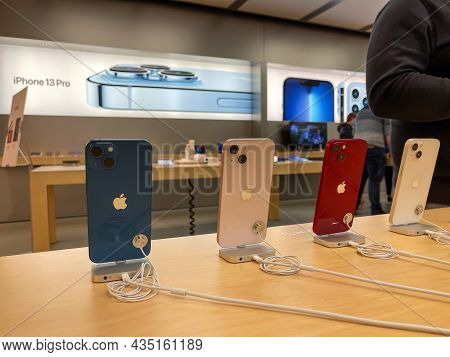 Cologne, Germany - October 01st 2021: A German Photographer Comparing And Testing The New Iphone 13 