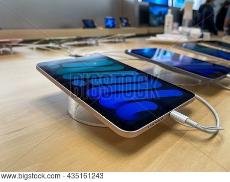 Cologne, Germany - September 30th 2021: A German Photographer Visiting An Apple Store, Comparing Tth