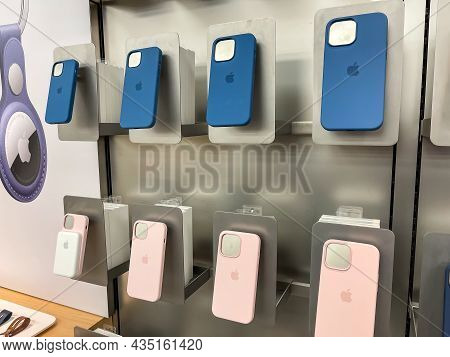 Cologne, Germany - September 30th 2021: A German Photographer Comparing Accessories As Phone Cases F